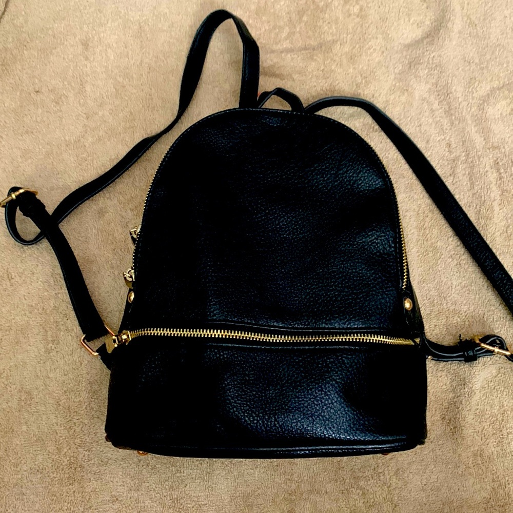 Medium sized pleather backpack.